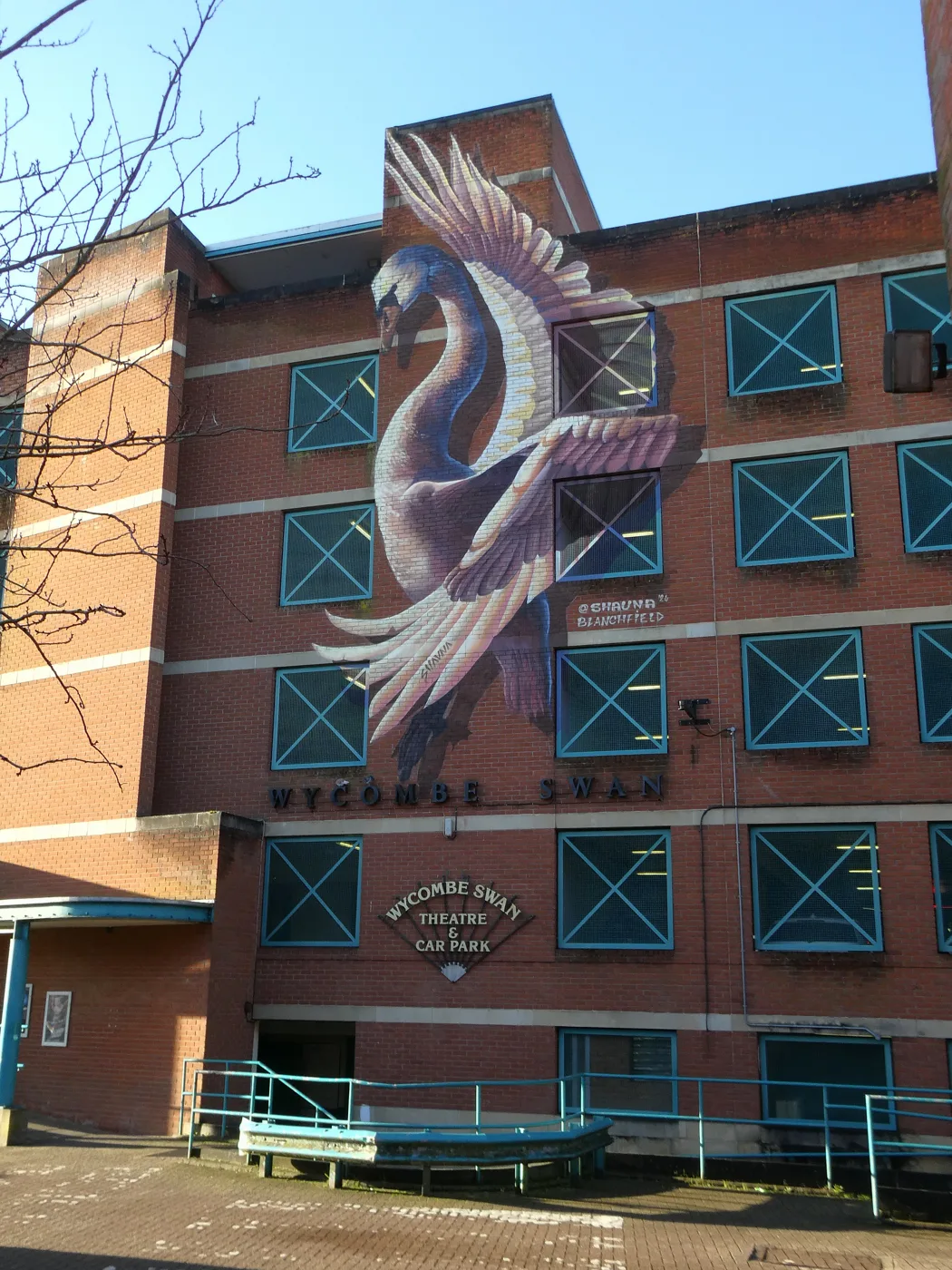 The Wycombe Swan multi-storey on St Mary Street, the largest council car park in the town centre at 323 spaces. The mural on its flank is signed by Shauna Blanchfield and dated 2024.